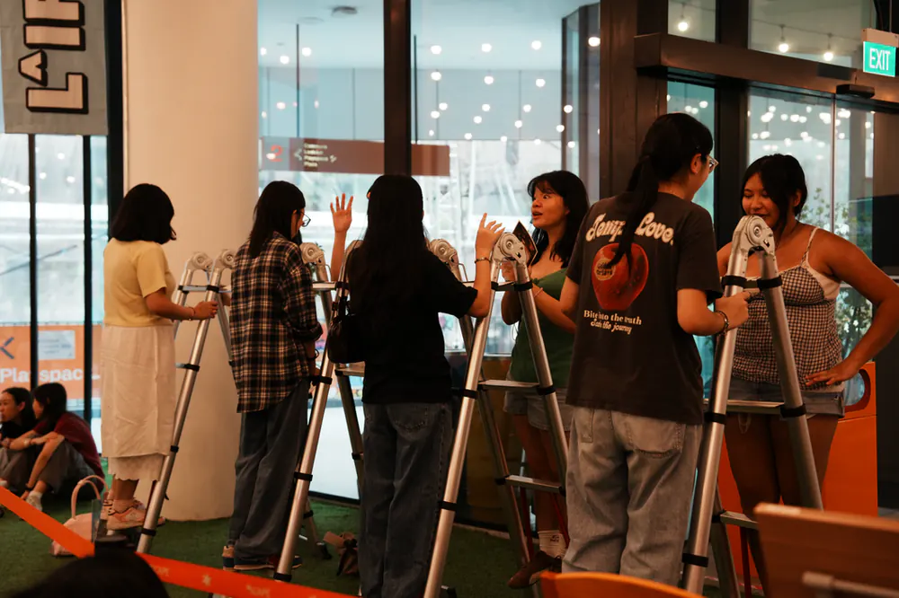 Strangers paired up on ladders for Conversation Ladders, Level 2